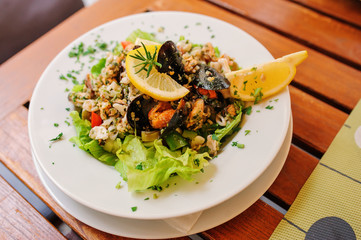 traditional slovenian cuisine, seafood salad with fresh mussels, selective focus
