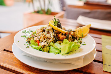 traditional slovenian cuisine, seafood salad with fresh mussels, selective focus