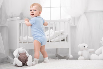 Portrait of a happy baby in the nursery