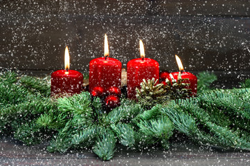 Advent decoration. Four red burning candles. Holidays background
