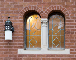 Windows and a Lamp on a Church Wall