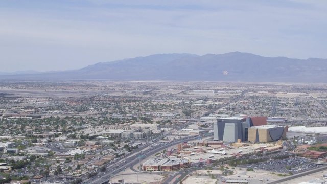 Aerial view from above looking at buildings, mountains and streets of Las Vegas, Nevada, USA