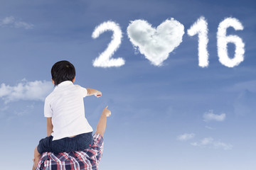 Boy and dad looking at numbers 2016