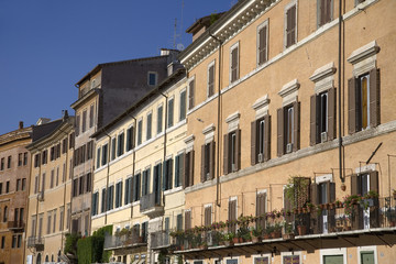 Fototapeta na wymiar Building front showing many windows of Rome, Italy, Europe