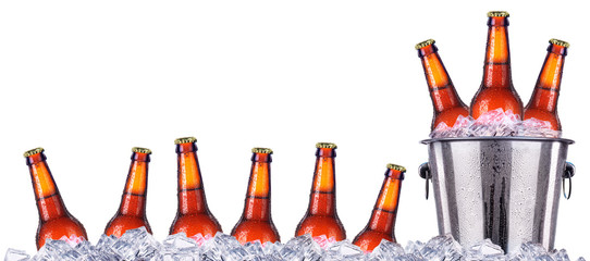 Set of beer's bottles with frosty drops in ice