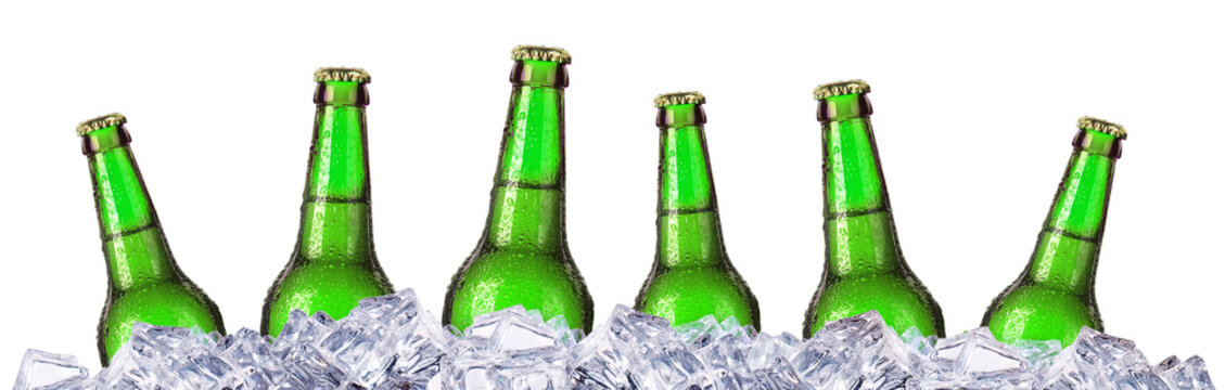 Set of beer's bottles with frosty drops in ice