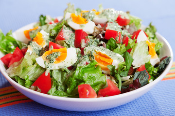 Summer salad with tomatos and boiled eggs
