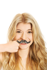 Blonde student with mustache looking at camera