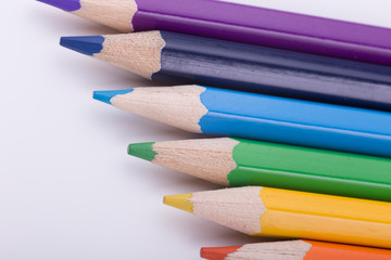 Fototapeta premium Many different colored pencils on white background