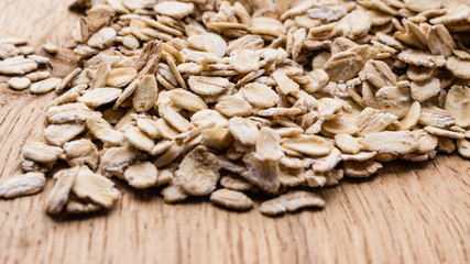 oat flakes cereal on wooden table.