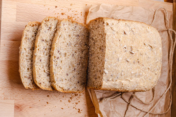 Sliced wholemeal bread on cutting board