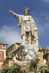 Obraz premium Statue of Christopher Columbus in town center pointing west in village of Santa Margarita, the Italian Riviera, Italy, Europe