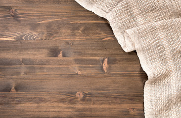 Gray handmade tablecloth from right side of wooden table