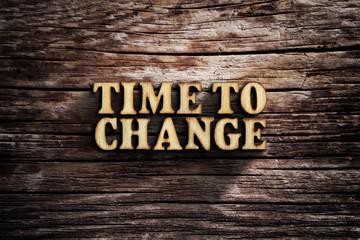 Fototapeta premium Time to change. Words on old wooden board.