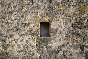 Stone windows of Casa de San Martin Inn, in Aragon, in the Pyrenees Mountains, Province of Huesca, Spain