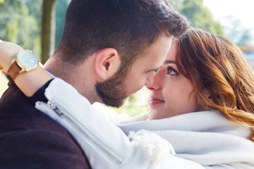 Fototapeta premium Young people kissing outdoors