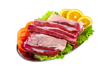 Fresh and raw meat ribs and pork chops isolated on white backgro