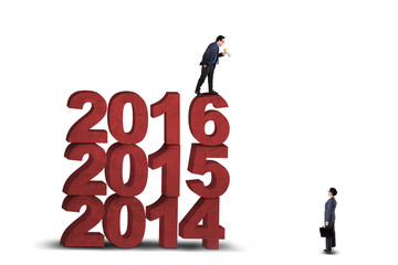 Fototapeta premium Worker talking on his partner with megaphone