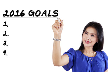 Worker writes business goals for 2016
