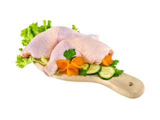 Chicken drumsticksraw on cutting board isolated on white backgro