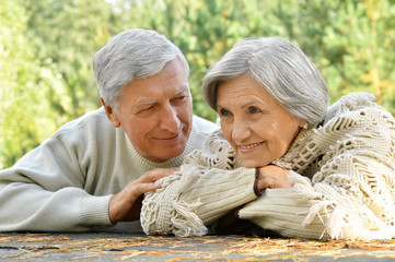 mature couple on  in summer park