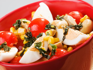 Salad with cherry tomato, eggs and corn