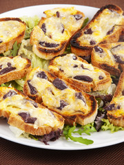 Bruschetta with olives and mozzarella
