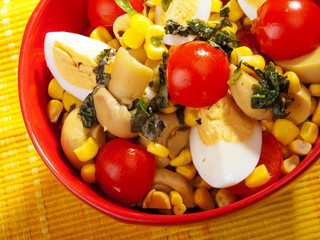 Salad with cherry tomato, eggs and corn