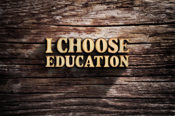 I choose Education. Words on old wooden board.