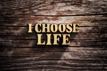 Fototapeta premium I choose Life. Words on old wooden board.