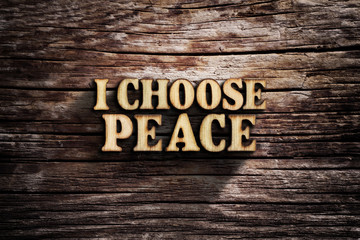 I choose Peace. Words on old wooden board.