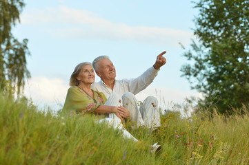 Elderly  couple on nature  at summer