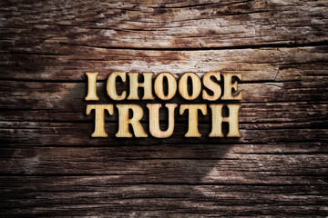 I choose Truth. Words on old wooden board.