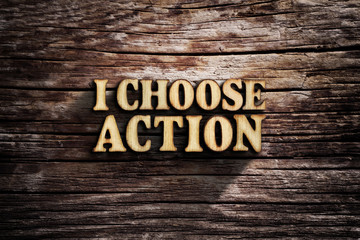 Fototapeta premium I choose Action. Words on old wooden board.
