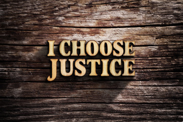 Fototapeta premium I choose Justice. Words on old wooden board.