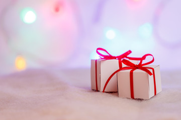 Decorated Christmas gifts on abstract background