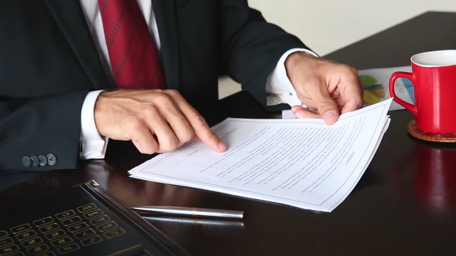 Businessman Signing A Contract at Office