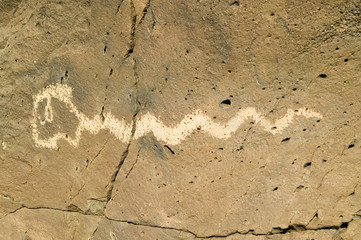 Native American petroglyphs featuring an image of a snake at Petroglyph National Monument, outside Albuquerque, New Mexico