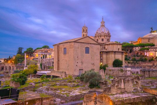 Roman Forum at dawn, Rome, Italy, with brick Curia and church of