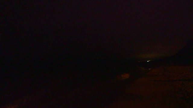 Thunderstorm and lightning flashes along coastline waterfront