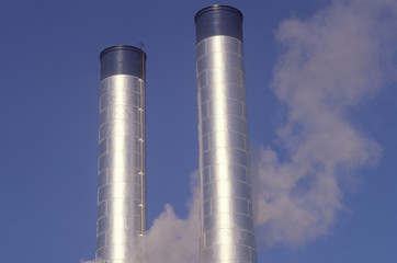 Two smokestacks in industrial America