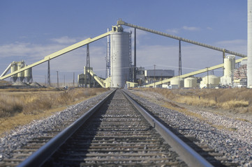Fototapeta na wymiar A railroad leading towards America's largest geothermal power plant in Wyodak, Wyoming