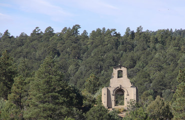 Fototapeta na wymiar Ruins of a Deserted Church on a Mountainside
