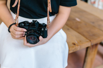 Black Vintage film Camera on wooden table