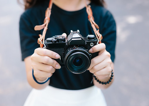 girl with vintage film camera