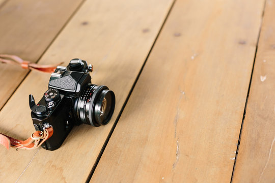 Vintage film Camera on wooden table