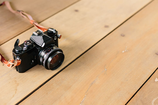 Vintage film Camera on wooden table