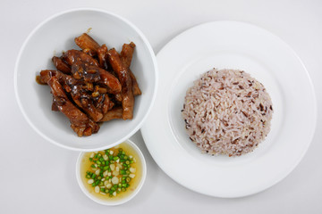 Brown rice and stir fried pork with black sweet soy sauce and chili fish sauce. (1)