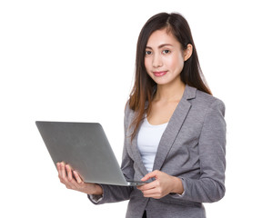 Asian Businesswoman use of the laptop computer