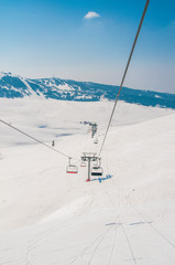 Ski lifts durings bright winter day
